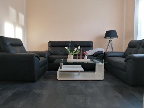 a living room with a couch and a coffee table at Eichis Landliebe in Gorschendorf