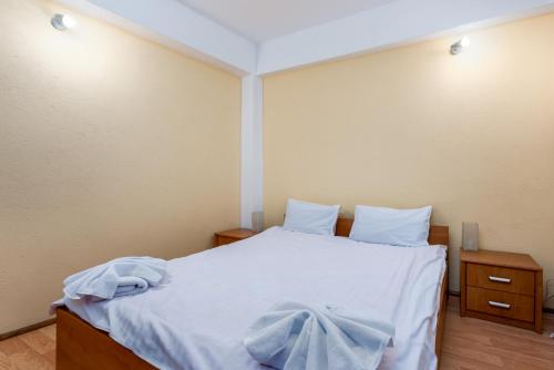 Postel nebo postele na pokoji v ubytování Central Apartament Predeal Nr 2