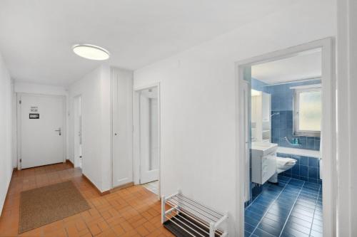 an empty bathroom with a toilet and a sink at Cozy 2 Bedroom Apartment in Zurich in Zürich