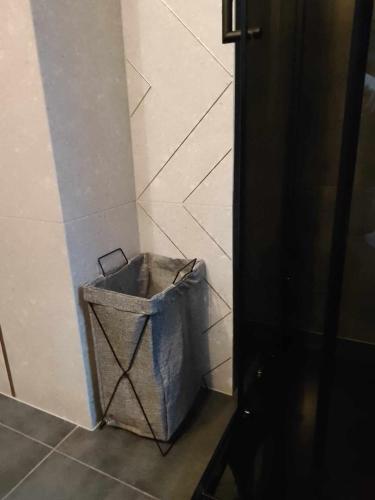 a trash can in a corner of a room at Zaciszny Zakątek Zawoja in Zawoja