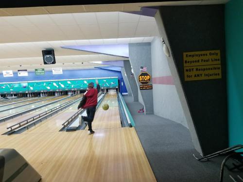 a man playing bowling in a bowling alley at GLAMPING Off Grid Tent ULTIMATE IN COMFORT in Turtletown