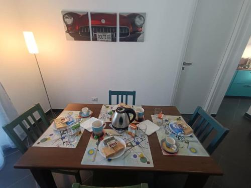a wooden table with a tea kettle on it at La Casa del Capo - appartamento con 2 camere. in Venaria Reale