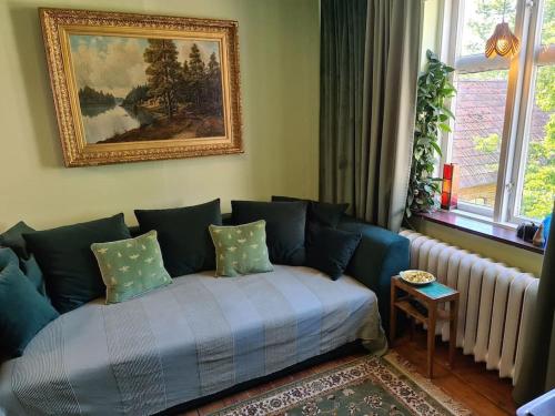 a living room with a couch and a window at Romantic apartment in Fjälkinge
