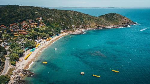 an aerial view of a beach with boats in the water at HOTEL VILLE LA PLAGE & BEACH CLUB in Búzios