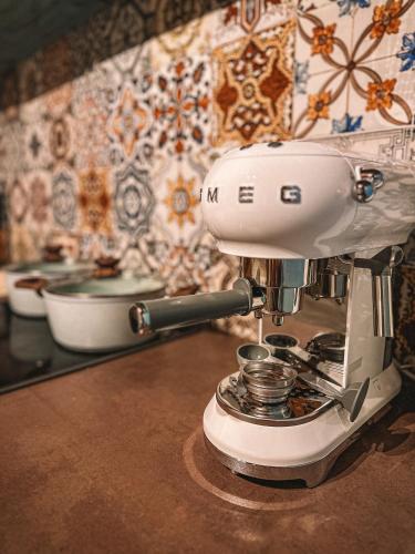 a white mixer sitting on top of a counter at Кътче in Leshten