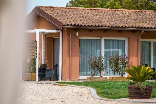 a small house with a patio at La Vinia Bed&Wine Experience - Adults Only in Sassari
