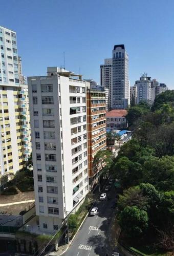 a view of a city with tall buildings at Get a Flat 401 - Duplex Luxuoso in São Paulo