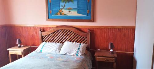 En eller flere senge i et værelse på Casa rustica, cercana a rio, a 15 minutos de Villarrica.
