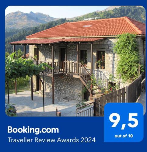a stone house with a red roof at Guesthouse Ventista-Ξενώνας in Theodoriana