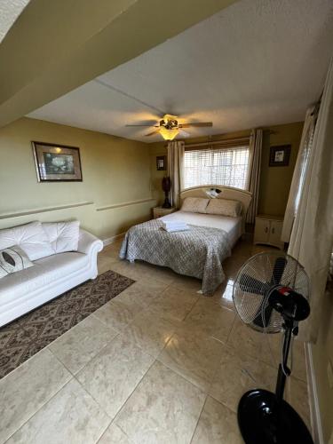 a bedroom with two beds and a ceiling fan at Boscobel Hideaway in Boscobel