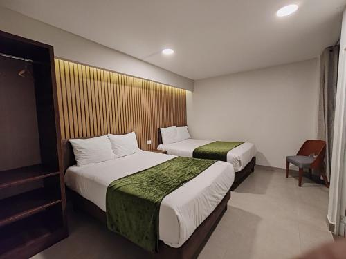 Una cama o camas en una habitación de Hotel Serra Nova