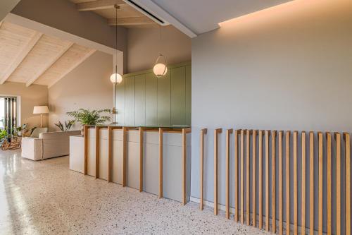 a lobby with a row of wooden dividers at Callisto Seaside Homes & Suites in Marathopolis
