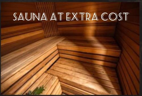 a inside of a saunaatechica cost sign on top of a wooden tub at Sea view Holmestrand sauna and hot tube appartment in Holmestrand