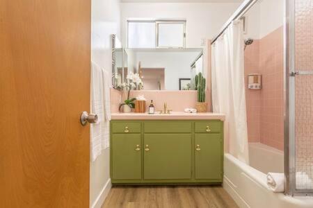a bathroom with a green sink and a shower at Mid Century 1BR Apt w Patio Near LAX Playa Vista Beach in Los Angeles