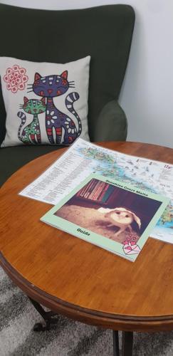 a table with a picture of a dog on it at Sunshine Court in St Paul's Bay