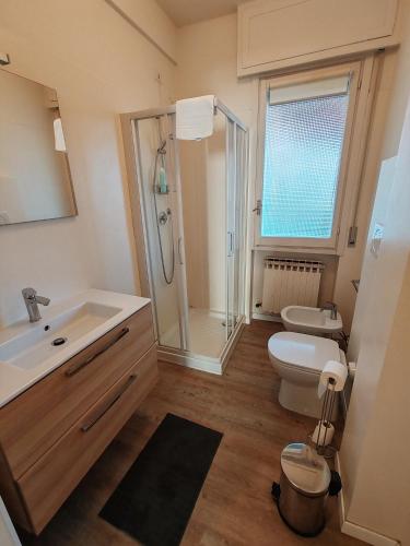 a bathroom with a sink and a toilet and a shower at Relax al Mare in Vallecrosia