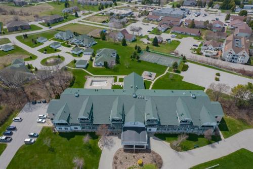 an aerial view of a large house with a green roof at Birchwood Lodge in Sister Bay