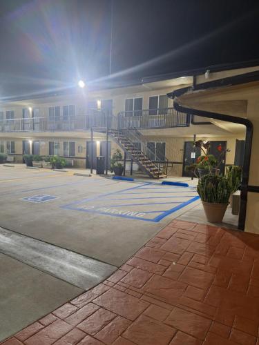 an empty parking lot in front of a building at Portofino Inn Burbank in Burbank