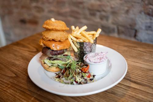 a plate of food with a sandwich and french fries at The Resolution Hotel in Whitby