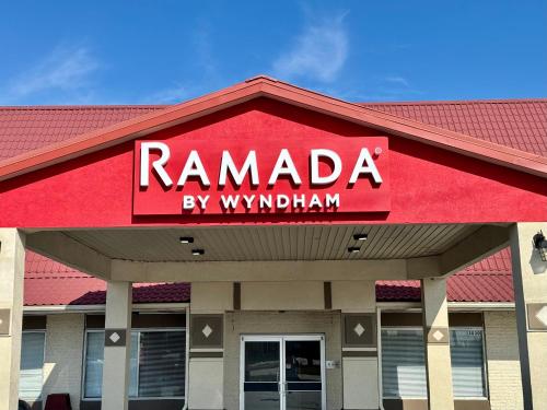 a ramada by wyndham sign on top of a building at Ramada by Wyndham Lumberton in Lumberton