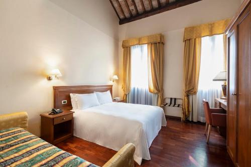 Postel nebo postele na pokoji v ubytování Hotel Alle Acque