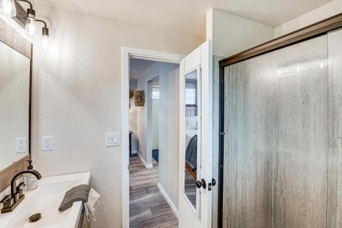 a bathroom with a shower and a sink and a mirror at Welcoming Sacramento Home Less Than 5 Mi to Downtown! in Sacramento