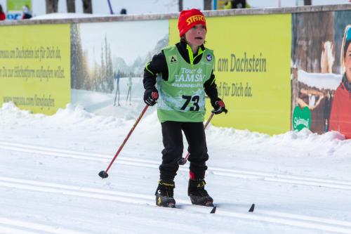 a young boy on skis in the snow at Landhaus Wieser in Ramsau am Dachstein