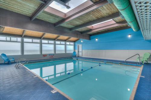 a large swimming pool in a large room with at D Sands Rentals in Lincoln City