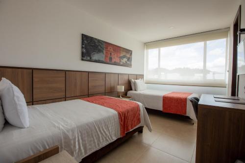 Hotel San Martin Popayanにあるベッド