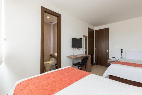 Hotel San Martin Popayanにあるベッド