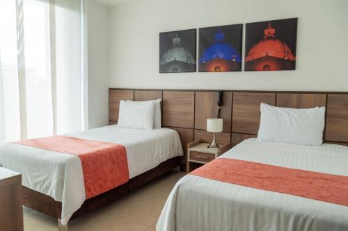 Hotel San Martin Popayanにあるベッド