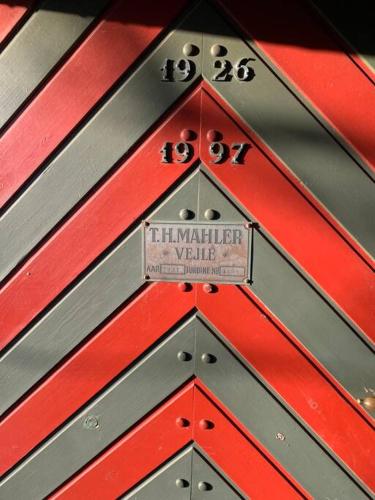 a red and gray object with a sign on it at The Mill House - Saeby Watermill in Sæby