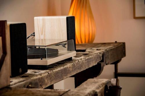 a microwave sitting on top of a wooden table at The Mill House - Saeby Watermill in Sæby