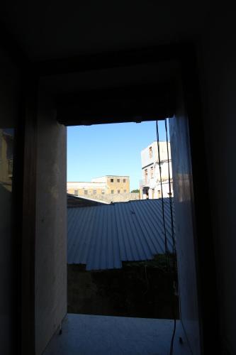 a window in a room with a view of a building at Casa 4 Archi in Lentini