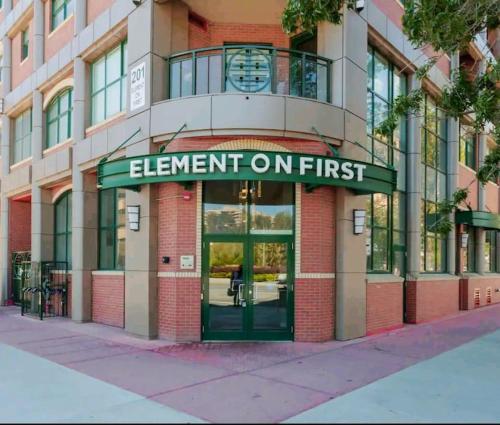 a building with a sign that reads element on first at Stunning 1 bedroom condo in Calgary with riverview in Calgary