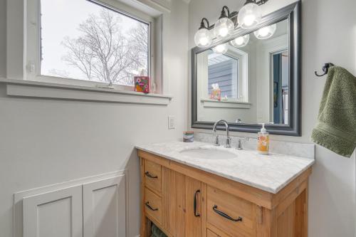 a bathroom with a sink and a mirror at Frankfort Vacation Rental Less Than 1 Mi to Lake Michigan! in Frankfort