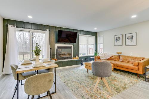 a living room with a couch and a table at East Stroudsburg Townhouse Less Than 1 Mi to Ski Area! in East Stroudsburg