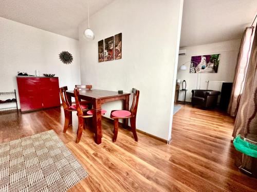 a dining room with a table and chairs at Unique central apartment in Poprad