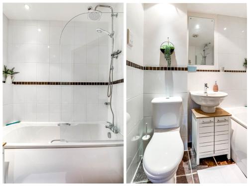 a bathroom with a tub and a toilet and a sink at Entire 2 Bed Flat Contractors Families and Relocators in Ware