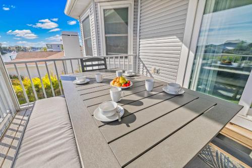 a table on a balcony with a bowl of fruit on it at 5 Bed3bath waterfront pool home with full gym, office, and heated pool! in Hernando Beach