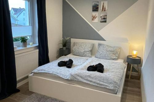 Stadtnah & Chic - Ihringshausen Retreat tesisinde bir odada yatak veya yataklar