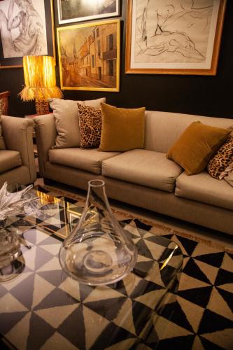 a living room with a couch and a glass table at Chic Miraflores AC HEATER 16th floor in Lima
