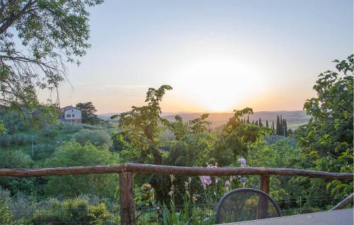 a view of the sun setting over a vineyard at Stunning Home In Paciano With Kitchen in Paciano