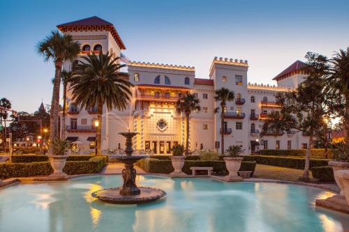 a large building with a fountain in front of it at Casa Monica Resort & Spa, Autograph Collection in St. Augustine