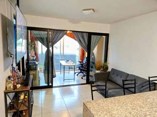 a living room with a couch and a table at "Paco's Depa" friendly & family apartment in Guadalajara