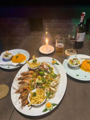 a table with plates of food on a table at Awesome Place in Ella