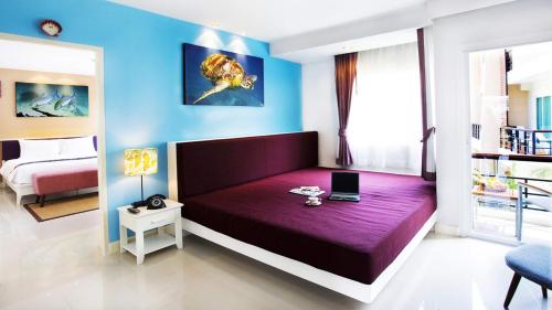 Кровать или кровати в номере The Beach Boutique House