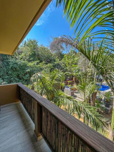 a balcony with a view of the jungle at Quinta Viajero in Zipolite