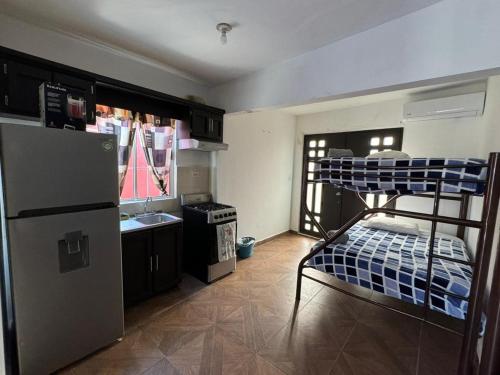Una cama o camas en una habitación de Suites Apodaca