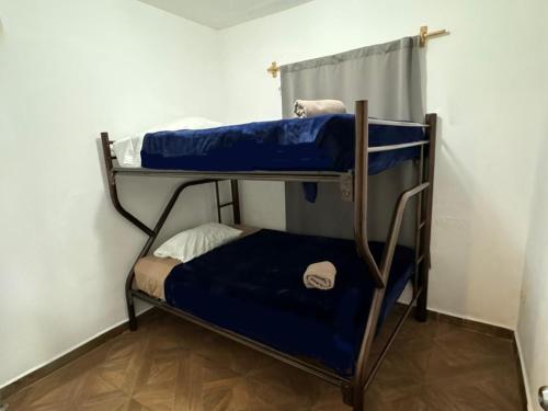 Una cama o camas en una habitación de Suites Apodaca
